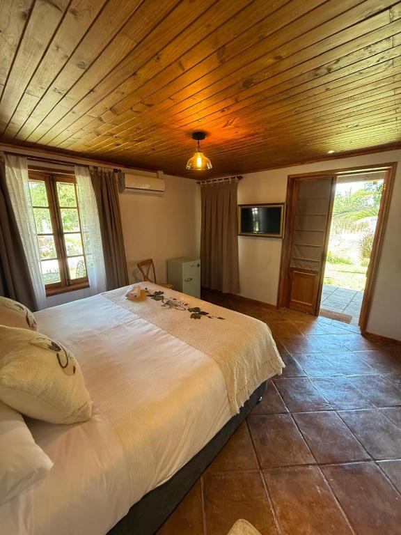 Postel nebo postele na pokoji v ubytování Hostal Campo Divino