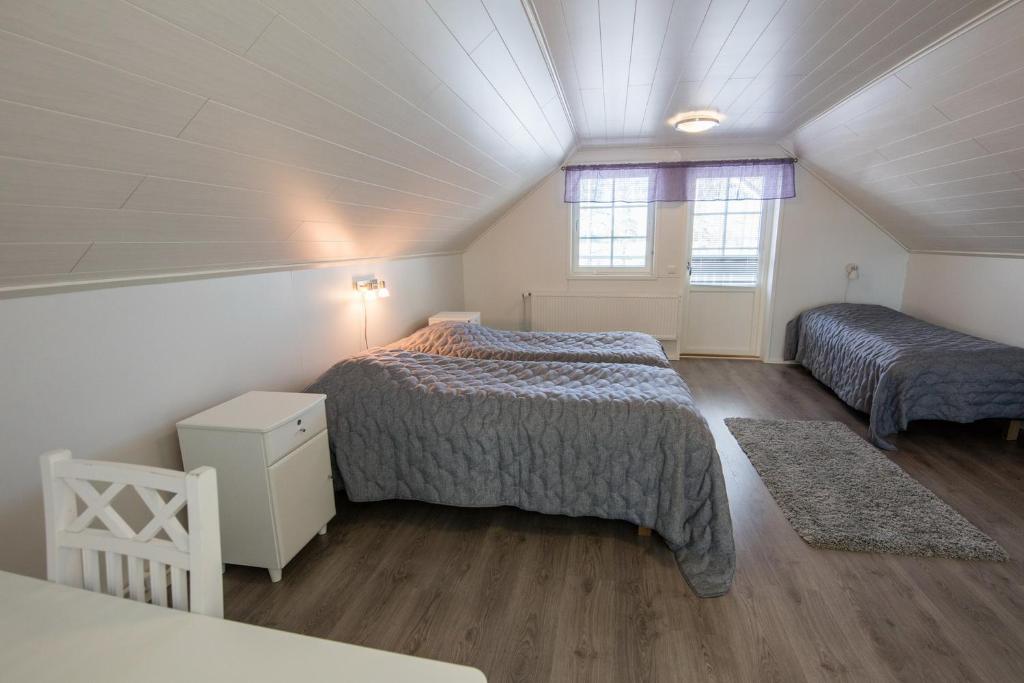 Postel nebo postele na pokoji v ubytování Kajaani Cottages
