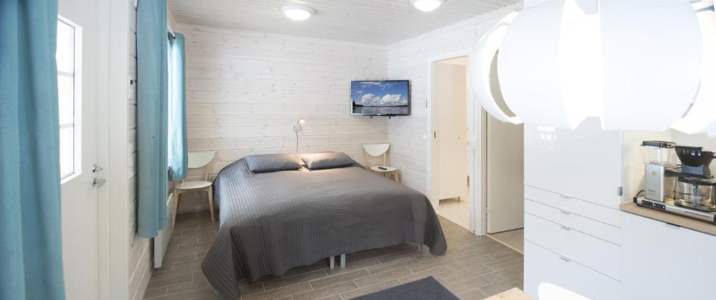 Postel nebo postele na pokoji v ubytování Kajaani Cottages