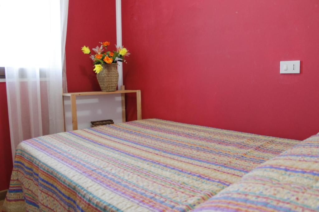 Ein Bett oder Betten in einem Zimmer der Unterkunft Casa Vacanza Luigi