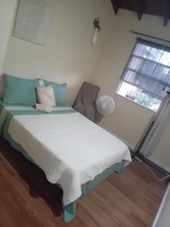 Postel nebo postele na pokoji v ubytování Chandler Homestay