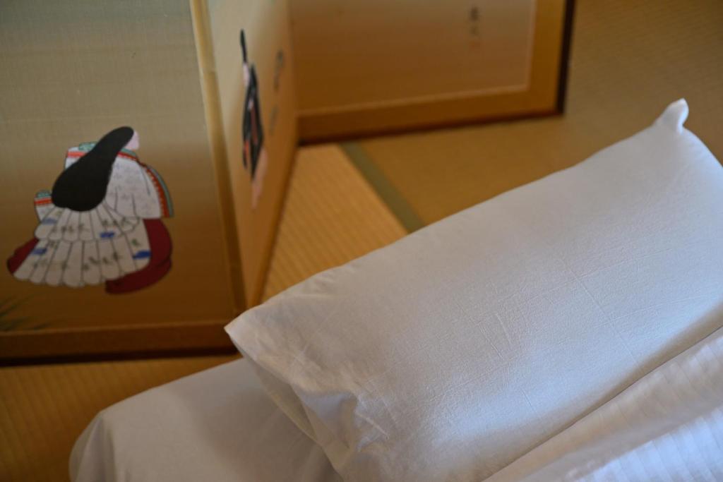 Postel nebo postele na pokoji v ubytování わとなみ