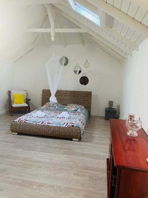 Postel nebo postele na pokoji v ubytování Villa Sous le Manguier-Anse Bertrand 5min plage