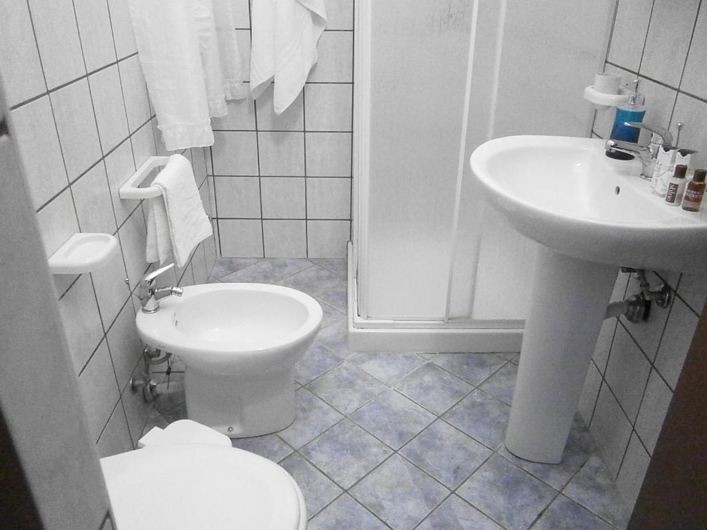 a bathroom with a toilet and a sink at B&B La Rosa Lampedusa in Lampedusa