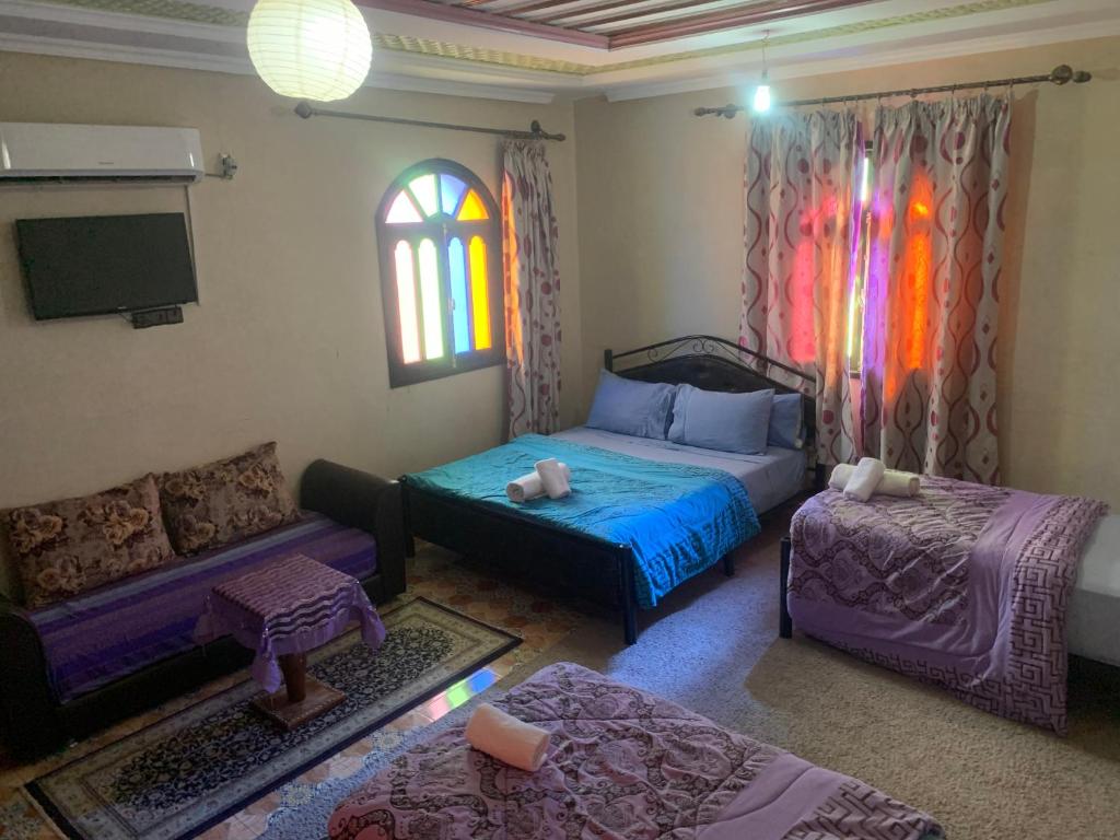 Postel nebo postele na pokoji v ubytování riad lala fatima
