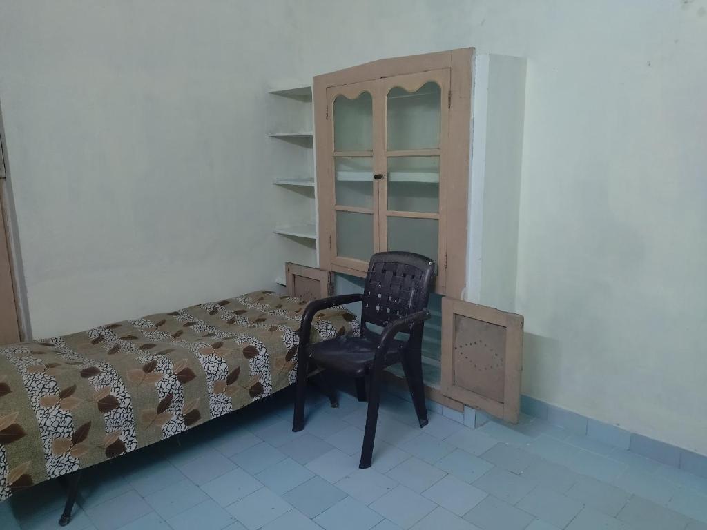 Postel nebo postele na pokoji v ubytování Sri kanakdhara homes