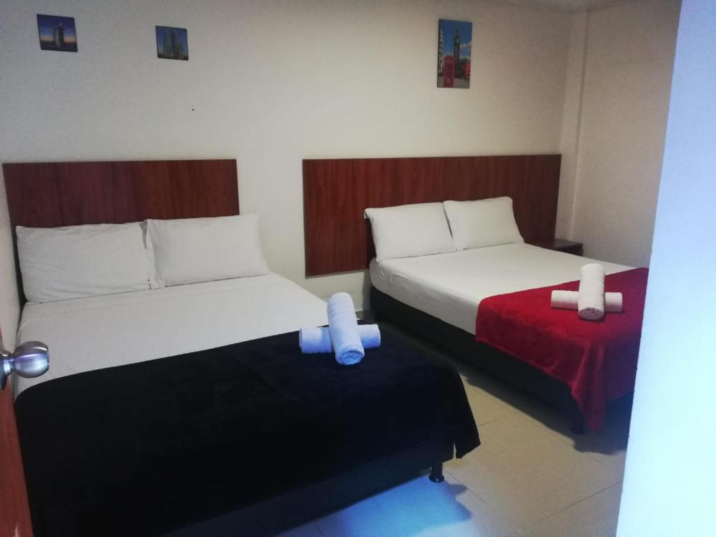 Postel nebo postele na pokoji v ubytování Hotel el cable pereira