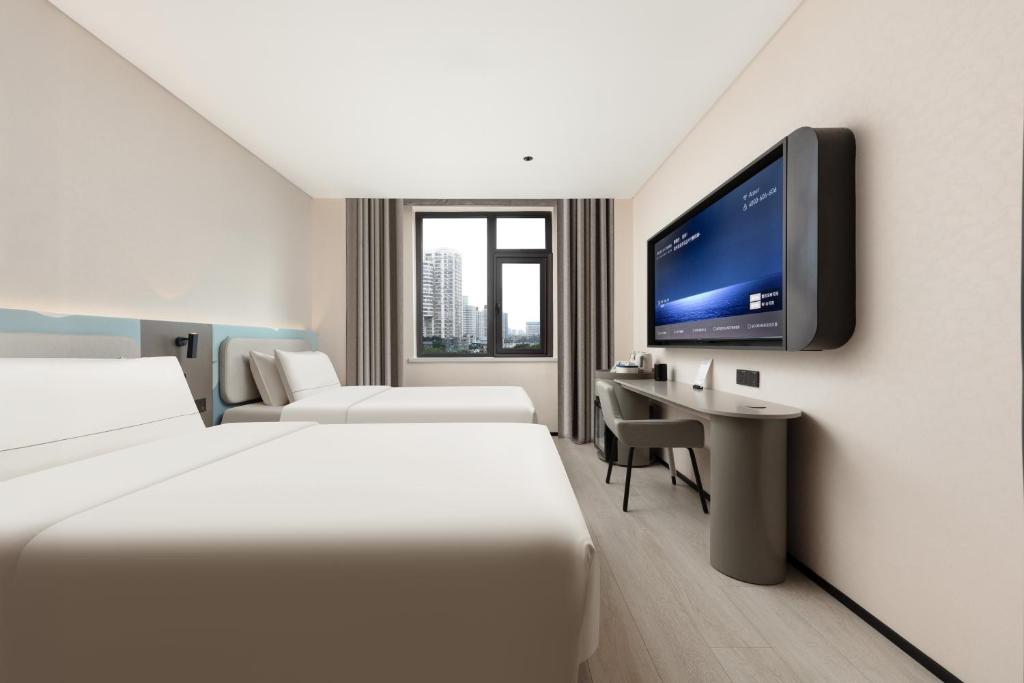 TV a/nebo společenská místnost v ubytování Atour Light Hotel Hangzhou Wulin Square Zhaohui Cultural Park