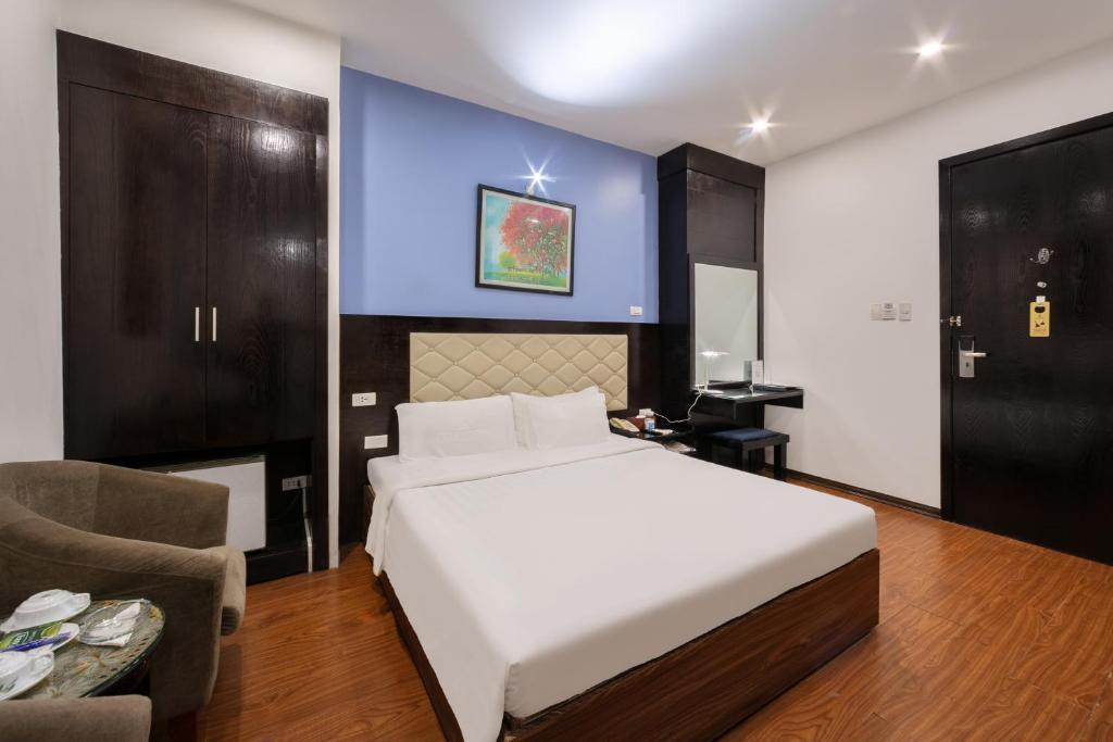 Postel nebo postele na pokoji v ubytování A25 Hotel - 15 Hàng Than