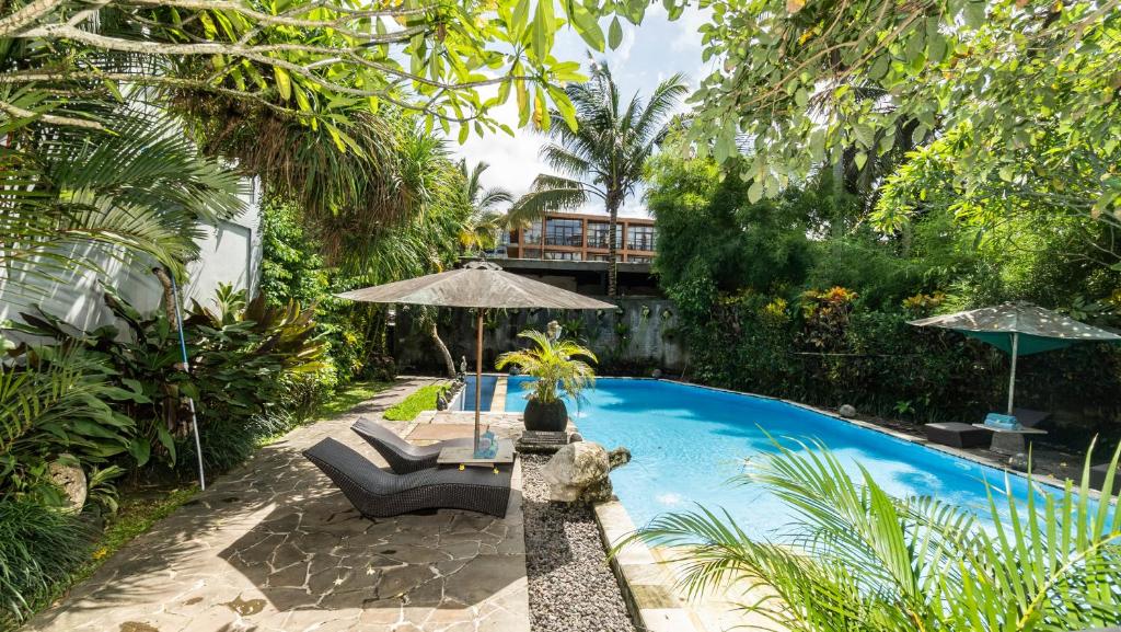 Baseinas apgyvendinimo įstaigoje Gita Maha Ubud Hotel by Mahaputra-CHSE Certified arba netoliese