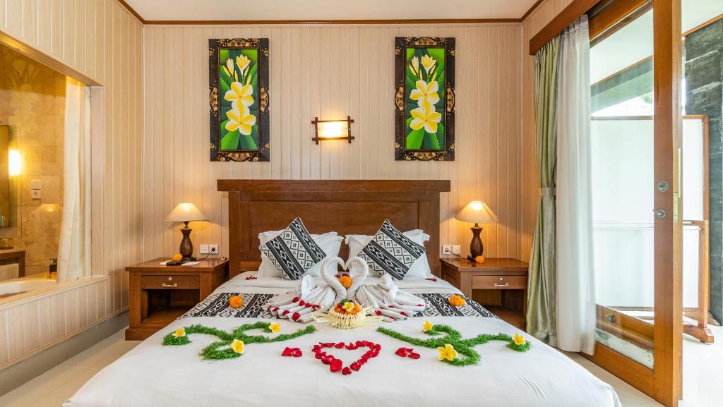Lova arba lovos apgyvendinimo įstaigoje Gita Maha Ubud Hotel by Mahaputra-CHSE Certified