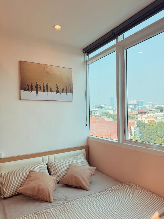 Postel nebo postele na pokoji v ubytování The Little Hanoi - Super Central Apartment