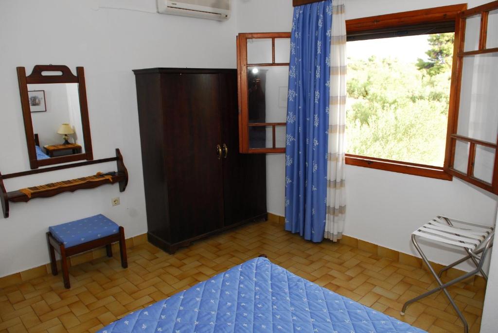 Кровать или кровати в номере Elia Apartments Sithonia