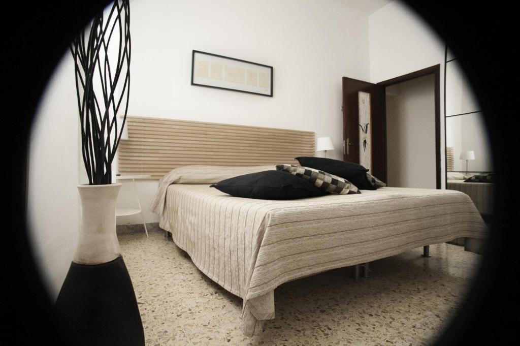 Postel nebo postele na pokoji v ubytování Briciole di Gusto