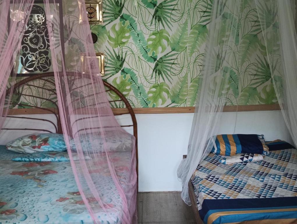Postel nebo postele na pokoji v ubytování El Faro 13 de Puerto Viejo