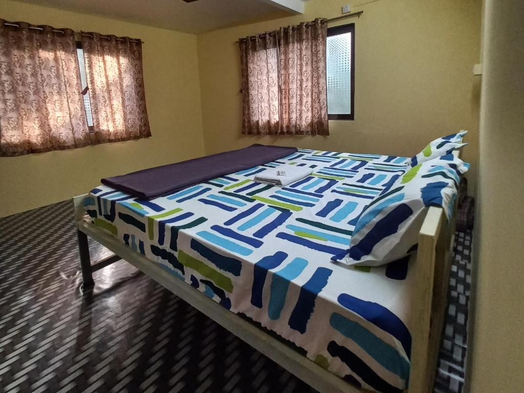 Postel nebo postele na pokoji v ubytování Juis Homestay Near Beach Property