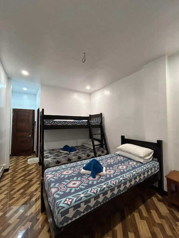 Postel nebo postele na pokoji v ubytování Seaslugs Travellers Inn
