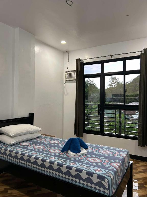 Postel nebo postele na pokoji v ubytování Seaslugs Travellers Inn