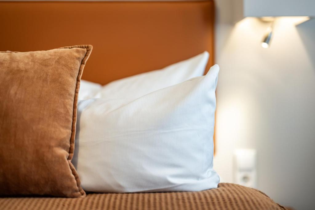 Postel nebo postele na pokoji v ubytování Hotel Goldene Steig