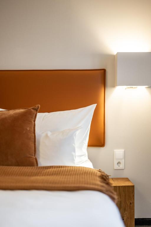 Postel nebo postele na pokoji v ubytování Hotel Goldene Steig