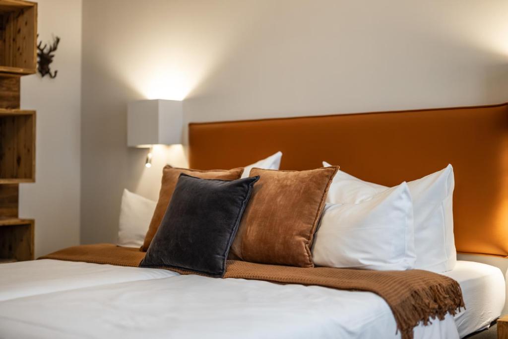 Postel nebo postele na pokoji v ubytování Hotel Goldene Steig