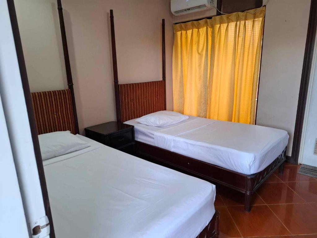 Postel nebo postele na pokoji v ubytování DDD Habitat, Inc - Cagayan De Oro