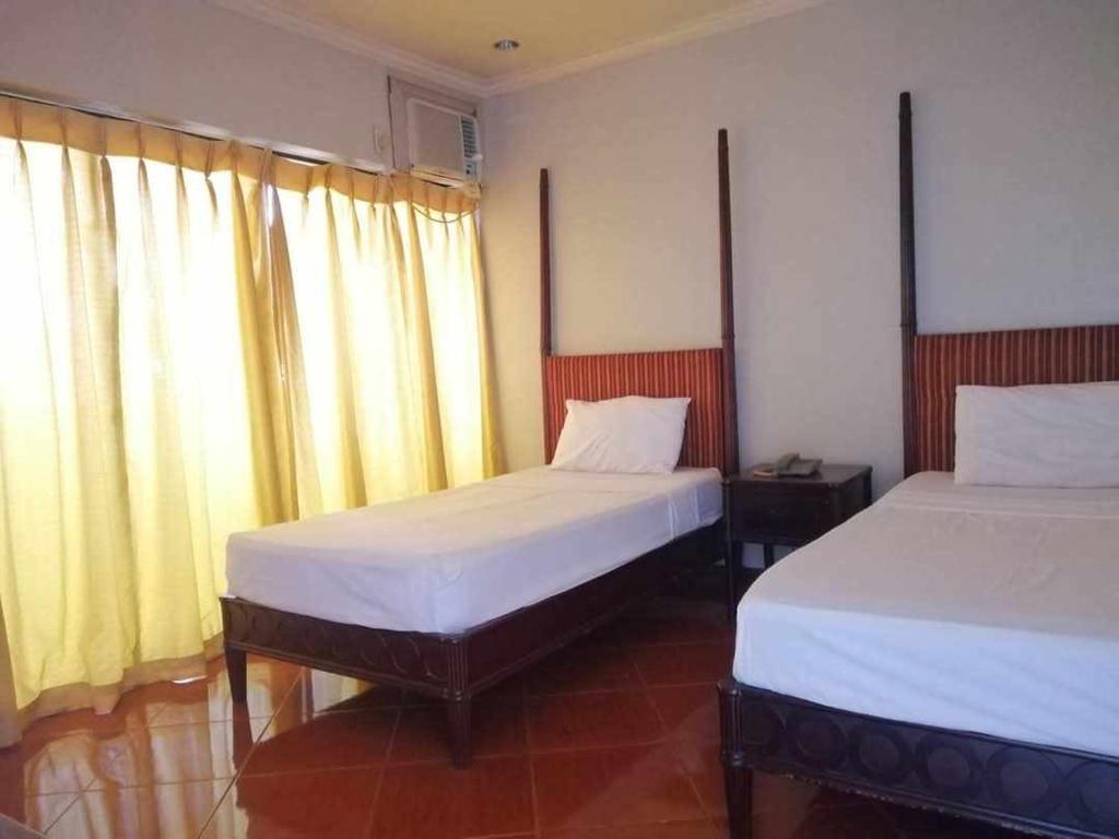 Postel nebo postele na pokoji v ubytování DDD Habitat, Inc - Cagayan De Oro