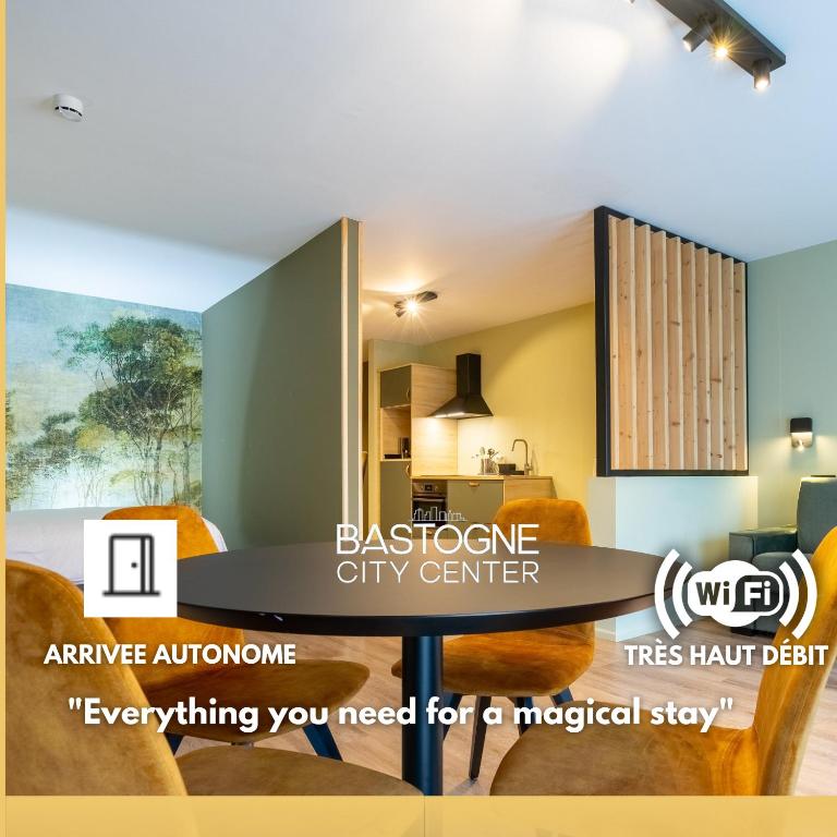 an image of a living room with a table and a kitchen at Appart hôtel En Ville in Bastogne
