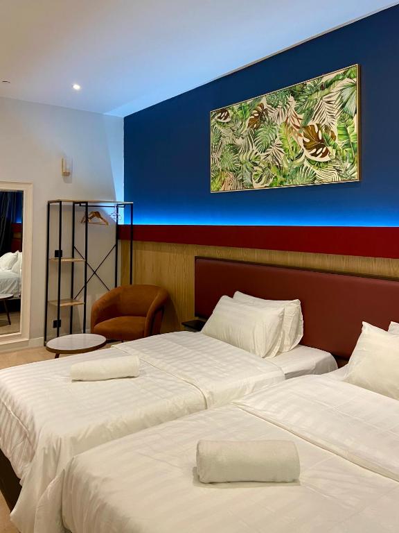 Postel nebo postele na pokoji v ubytování Showcase Hotel Kota Kinabalu