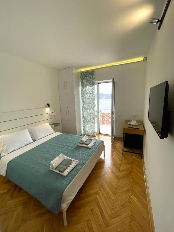 Postel nebo postele na pokoji v ubytování Ancora Hotel
