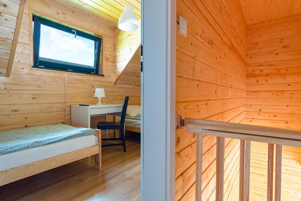 Postel nebo postele na pokoji v ubytování Osada Jantar 3