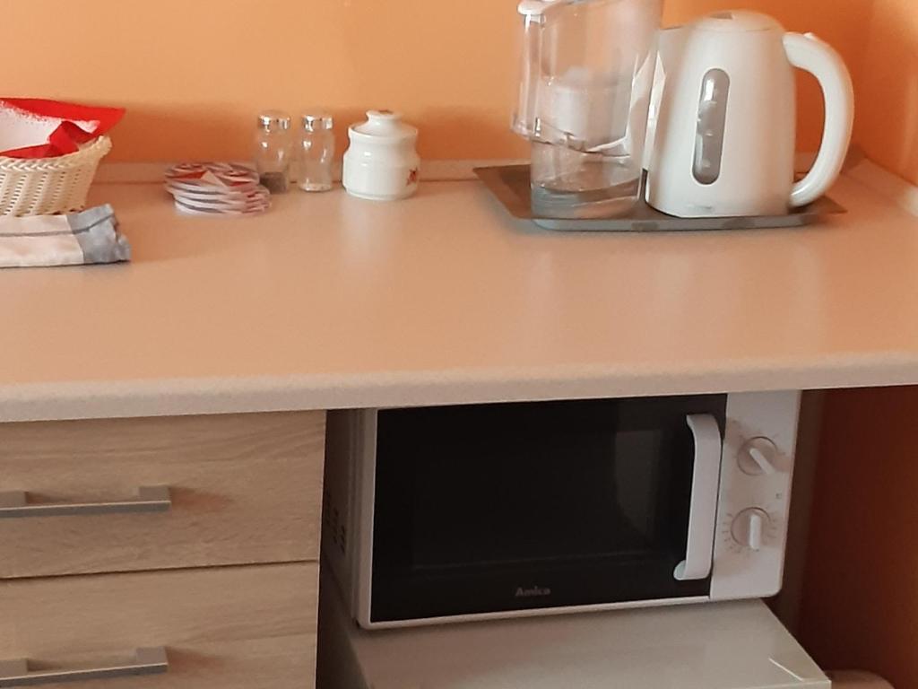 Kuchyňa alebo kuchynka v ubytovaní Słoneczko