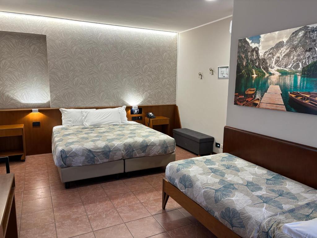 Postel nebo postele na pokoji v ubytování Villa Nasti Hotel Ristorante