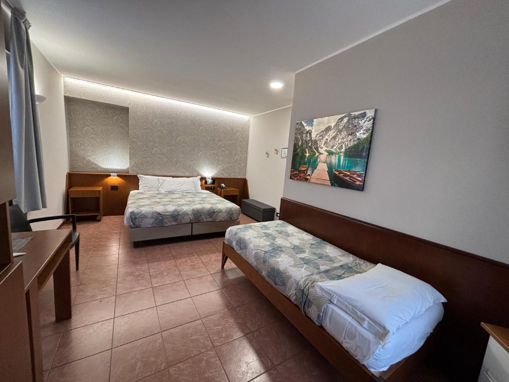 Postel nebo postele na pokoji v ubytování Villa Nasti Hotel Ristorante