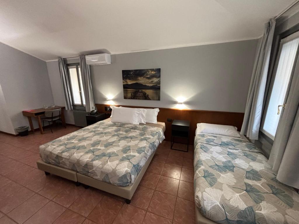 Postel nebo postele na pokoji v ubytování Villa Nasti Hotel Ristorante
