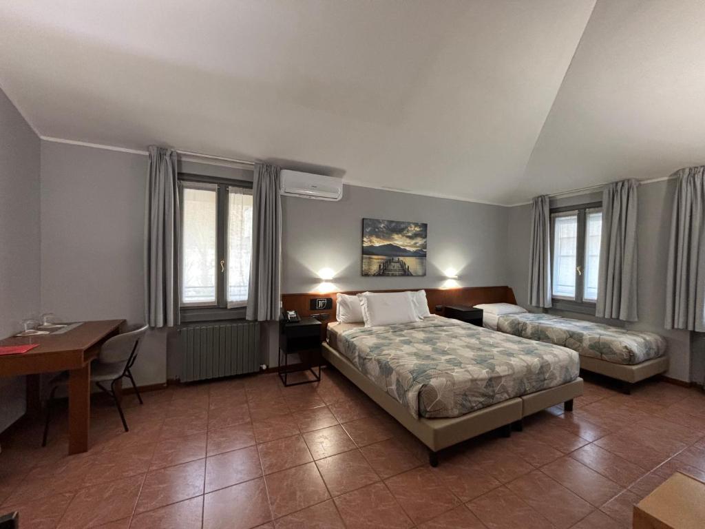 Postel nebo postele na pokoji v ubytování Villa Nasti Hotel Ristorante
