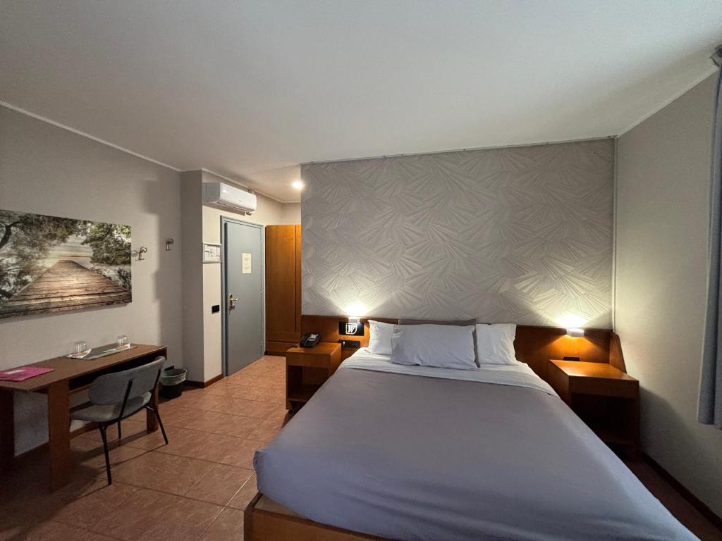 Postel nebo postele na pokoji v ubytování Villa Nasti Hotel Ristorante
