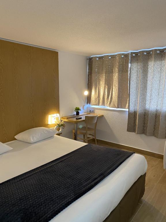 Postel nebo postele na pokoji v ubytování Kyriad ECO - Belfort Bessoncourt