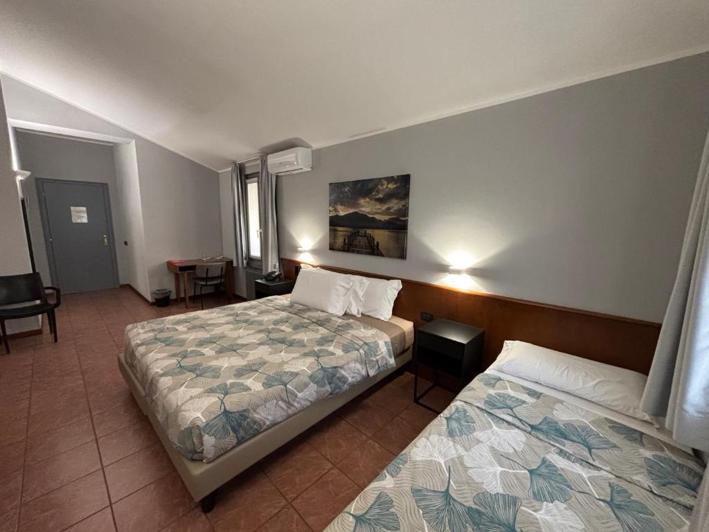 Postel nebo postele na pokoji v ubytování Villa Nasti Hotel Ristorante
