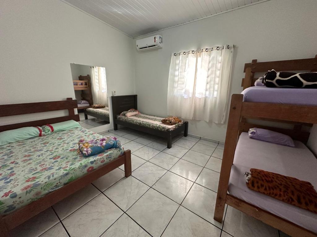 Postel nebo postele na pokoji v ubytování Casinha Flor de Lis