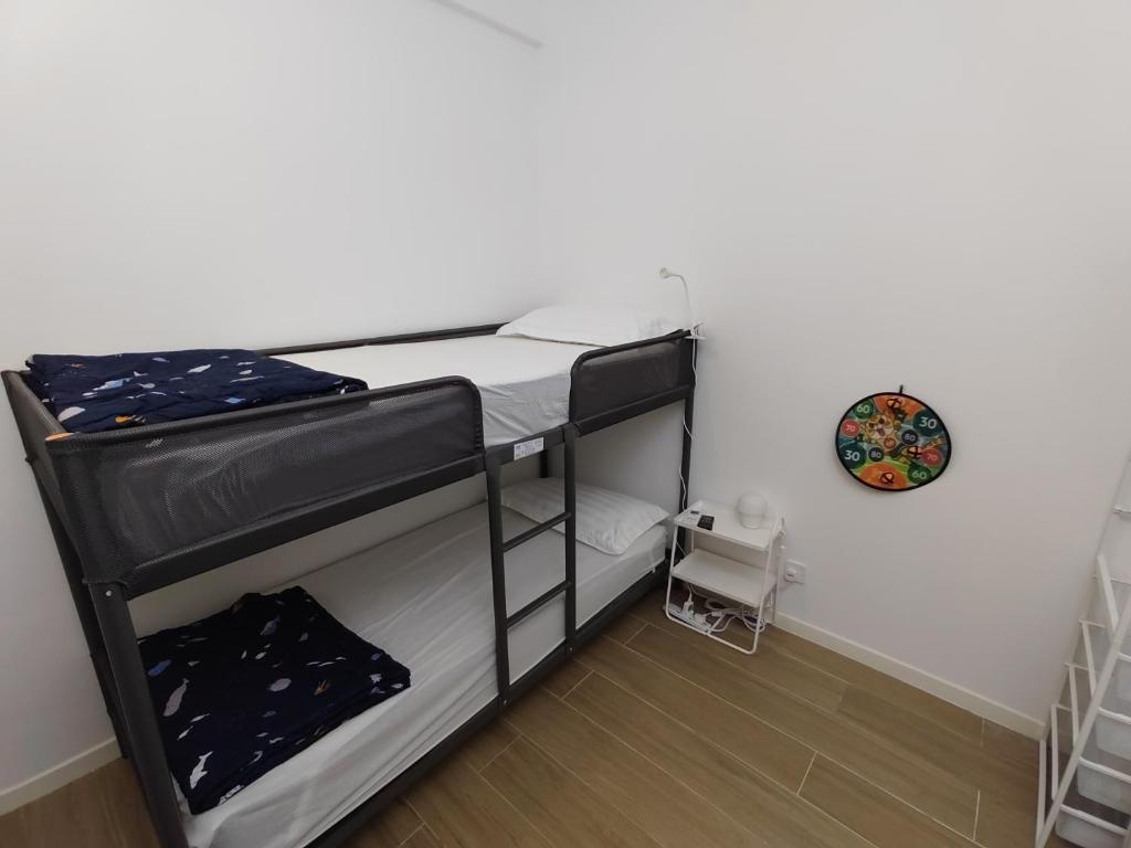 Postel nebo postele na pokoji v ubytování Bay Suite - Minuli