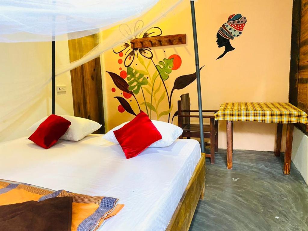 Postel nebo postele na pokoji v ubytování Aira Bay Resort Arugambay