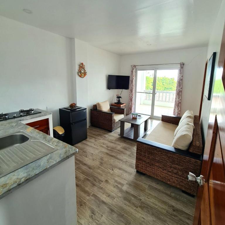 TV a/nebo společenská místnost v ubytování Tablas Seaview Homestay