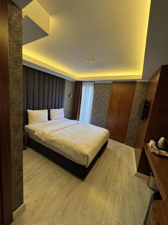 Postel nebo postele na pokoji v ubytování Sultan city hotel
