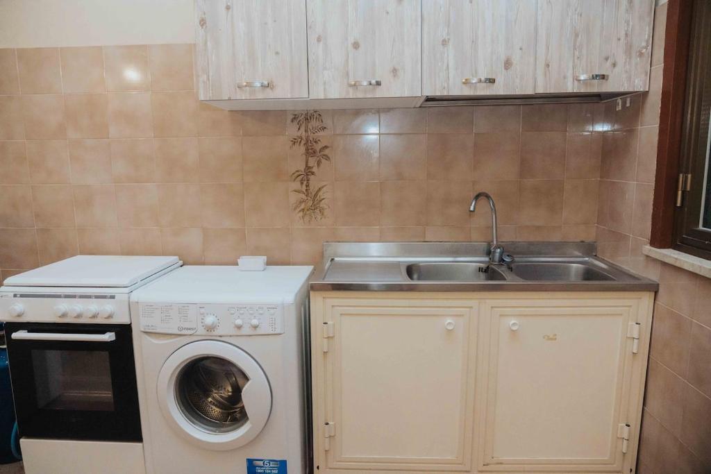 Kuchyň nebo kuchyňský kout v ubytování Appartamento con terrazzo