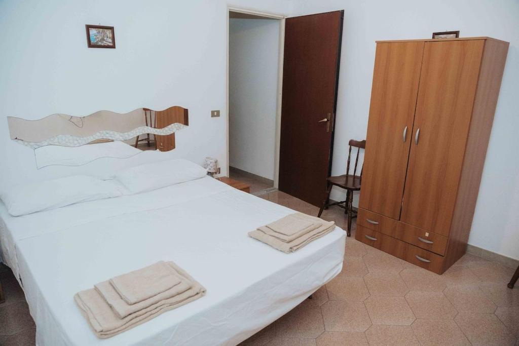 Postel nebo postele na pokoji v ubytování Appartamento con terrazzo