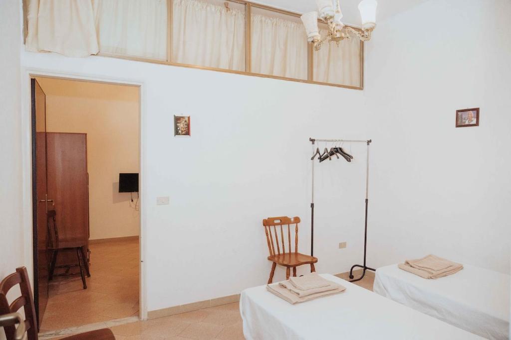 Postel nebo postele na pokoji v ubytování Appartamento con terrazzo