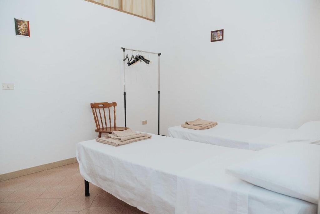 Postel nebo postele na pokoji v ubytování Appartamento con terrazzo