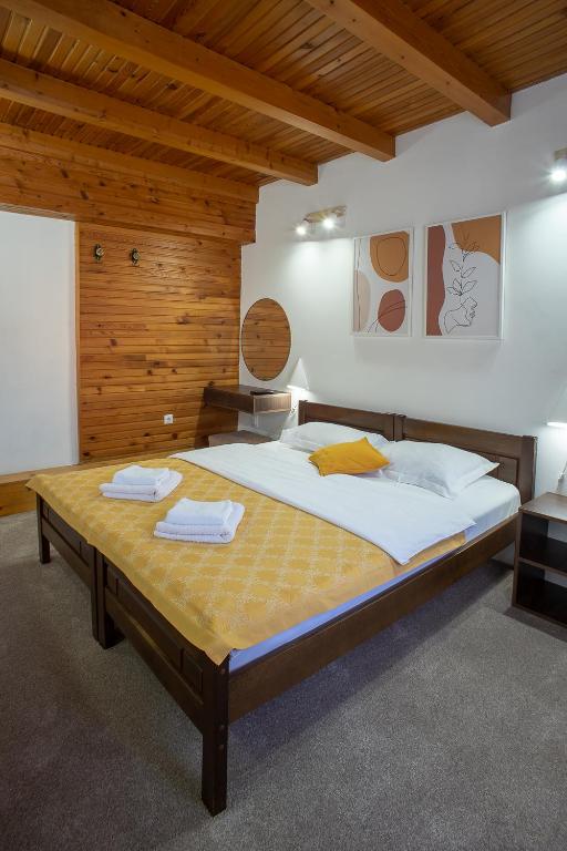 Postel nebo postele na pokoji v ubytování MB Hotel