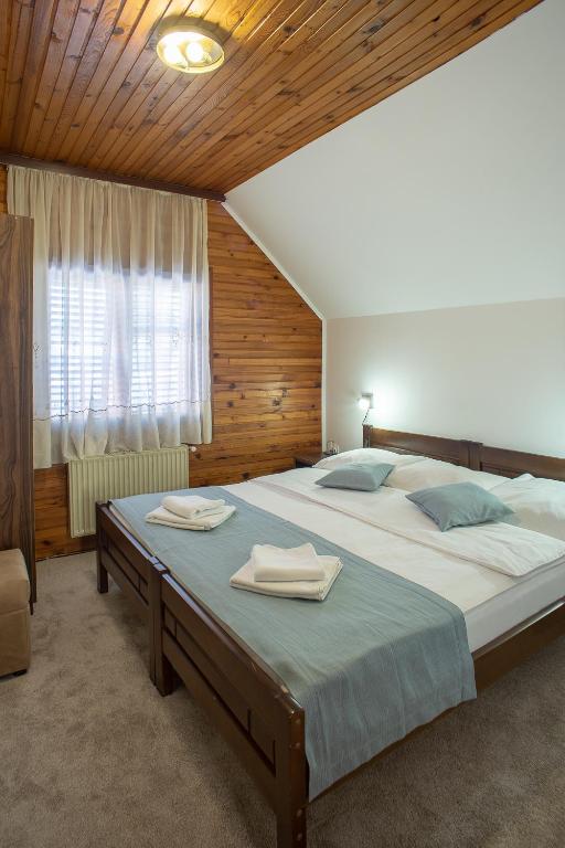 Postel nebo postele na pokoji v ubytování MB Hotel